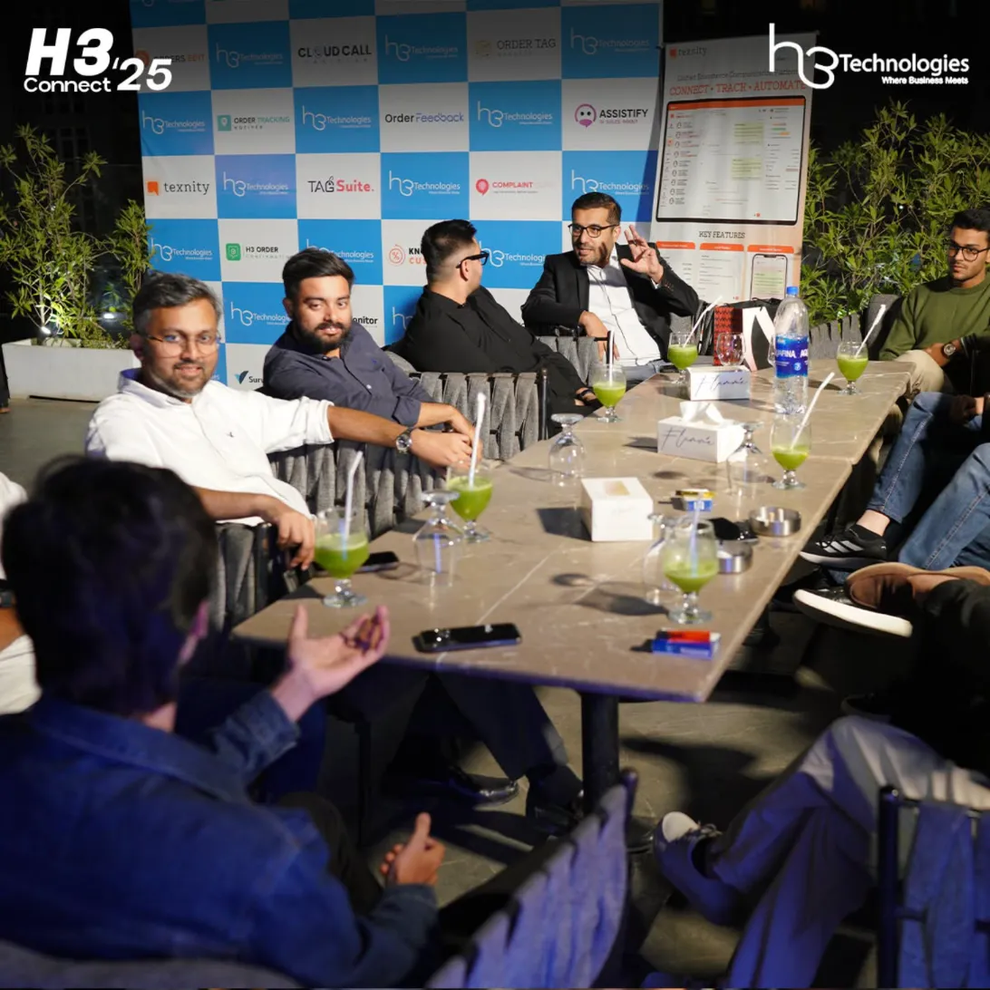Guests talking around the table at H3 Connect
