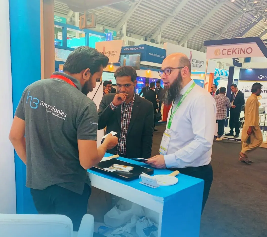 H3 team talking with visitors at ITCN Asia Lahore