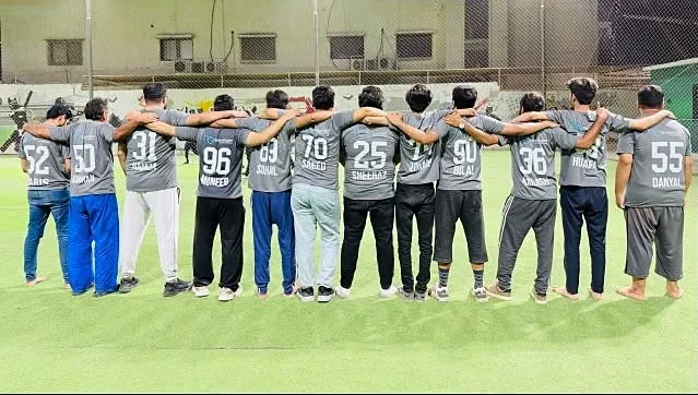 H3 team arm in arm wearing numbered H3 shirts