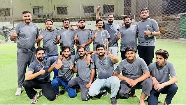 H3 team giving a thumbs up at cricket night